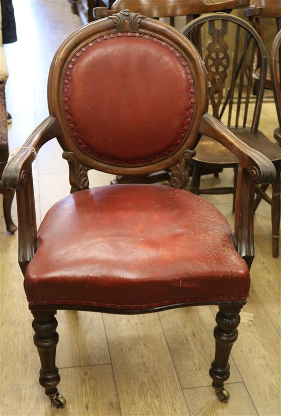 A walnut and leather elbow chair